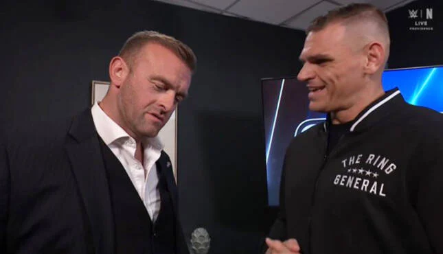 Smackdown GM Nick Aldis with Gunther